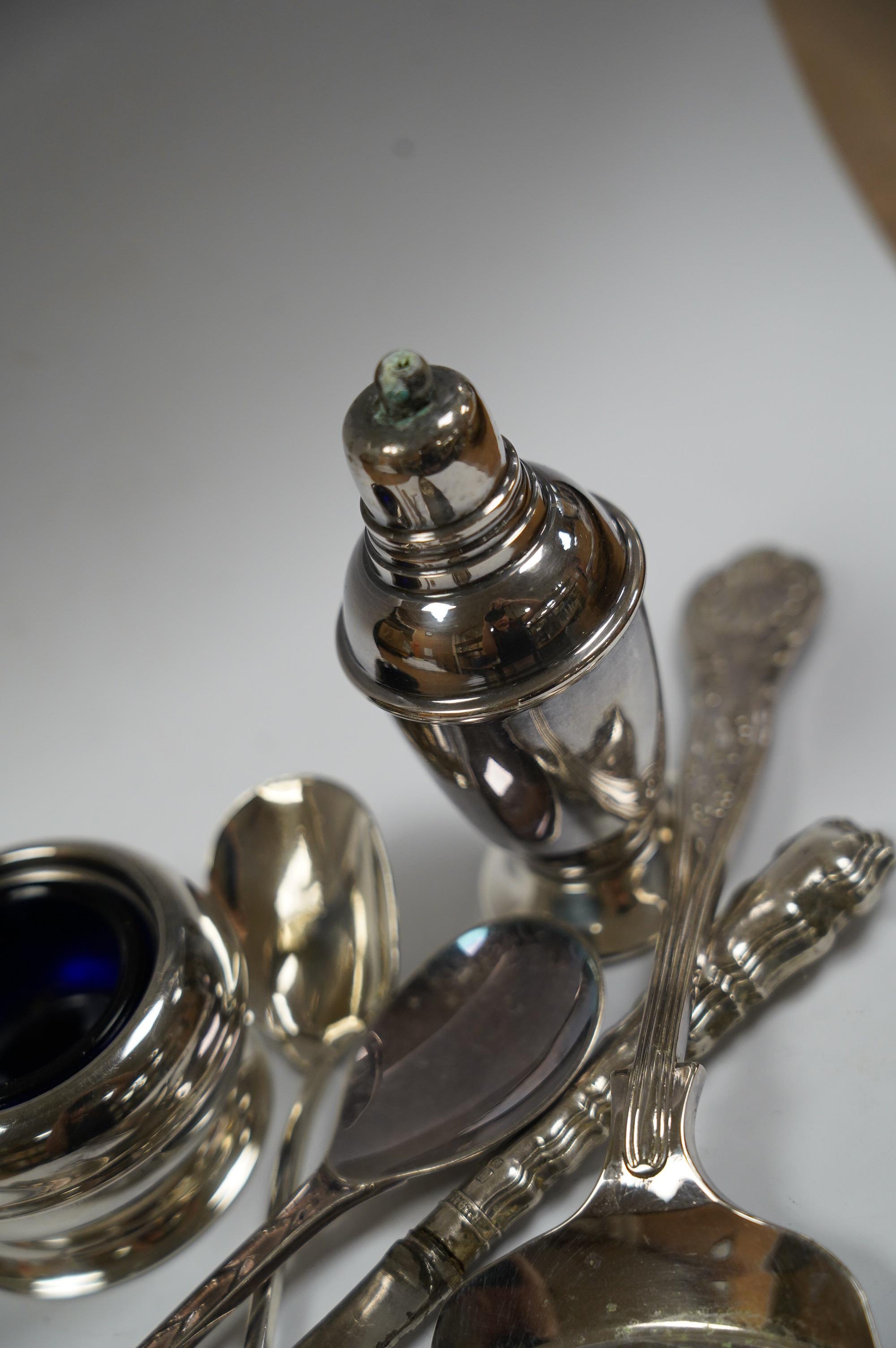 A small group of assorted teaspoons, condiment spoons, small servers, etc. including a Millennium seal top spoon by A. E. Jones Ltd and a Victorian shell bowl ladle by Jehoiada Alsop Rhodes and a silver thimble together